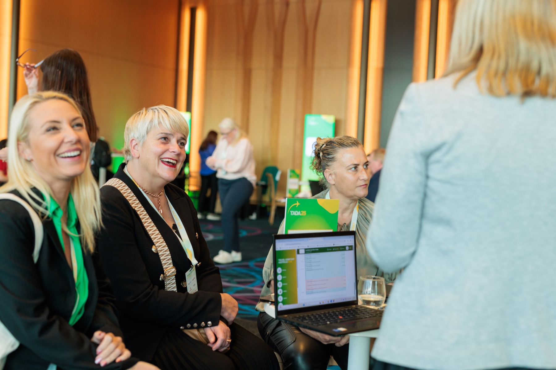 Travel professionals sharing a conversation at TADA25